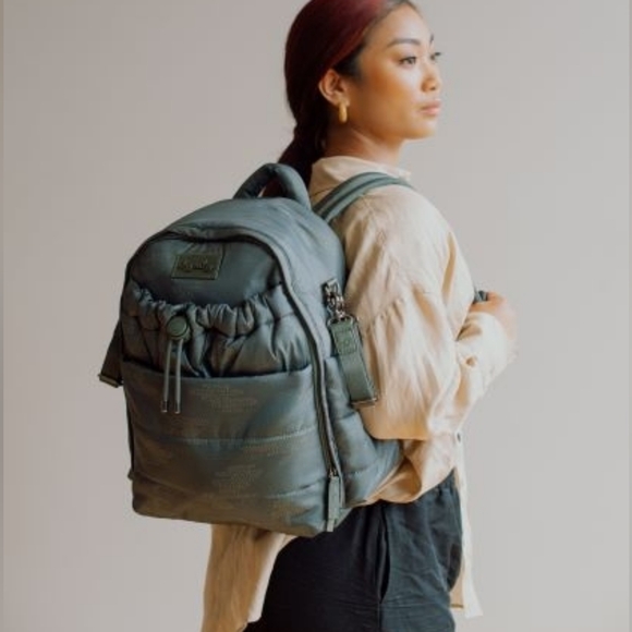 Itsy Ritzy Dream Backpack Sling Diaper Bag in Army Cloud Camo - Picture 1 of 13